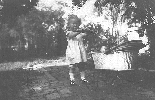 Elizabeth with her little doll in the doll baby carriage in Paotingfu