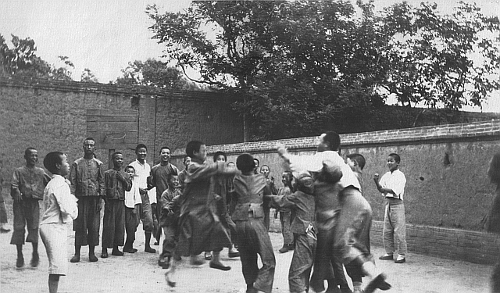 Students on basketball court at Dartmouth School in Kao I